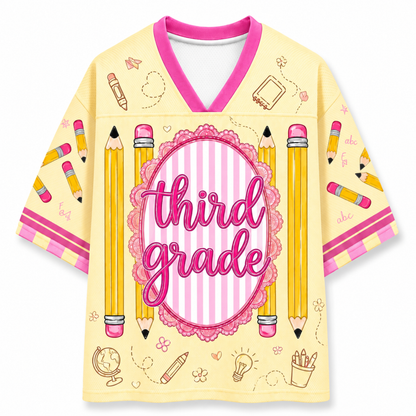 Yellow jersey with 'third grade' text and pencil designs on a white background
