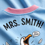 Light blue shirt with 'MRS. SMITH!' text and cartoon duck design.