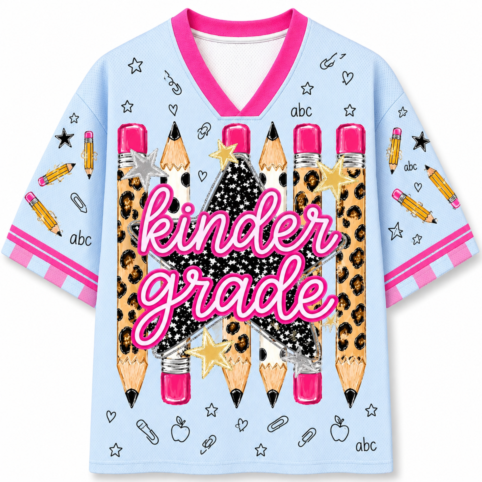 A light blue short-sleeve V-neck t-shirt with a 'Kinder Grade' school-themed graphic. The design features large pencils with leopard print and pink erasers, a black glittery star pattern, and pink script text reading 'Kinder Grade' across the center.
