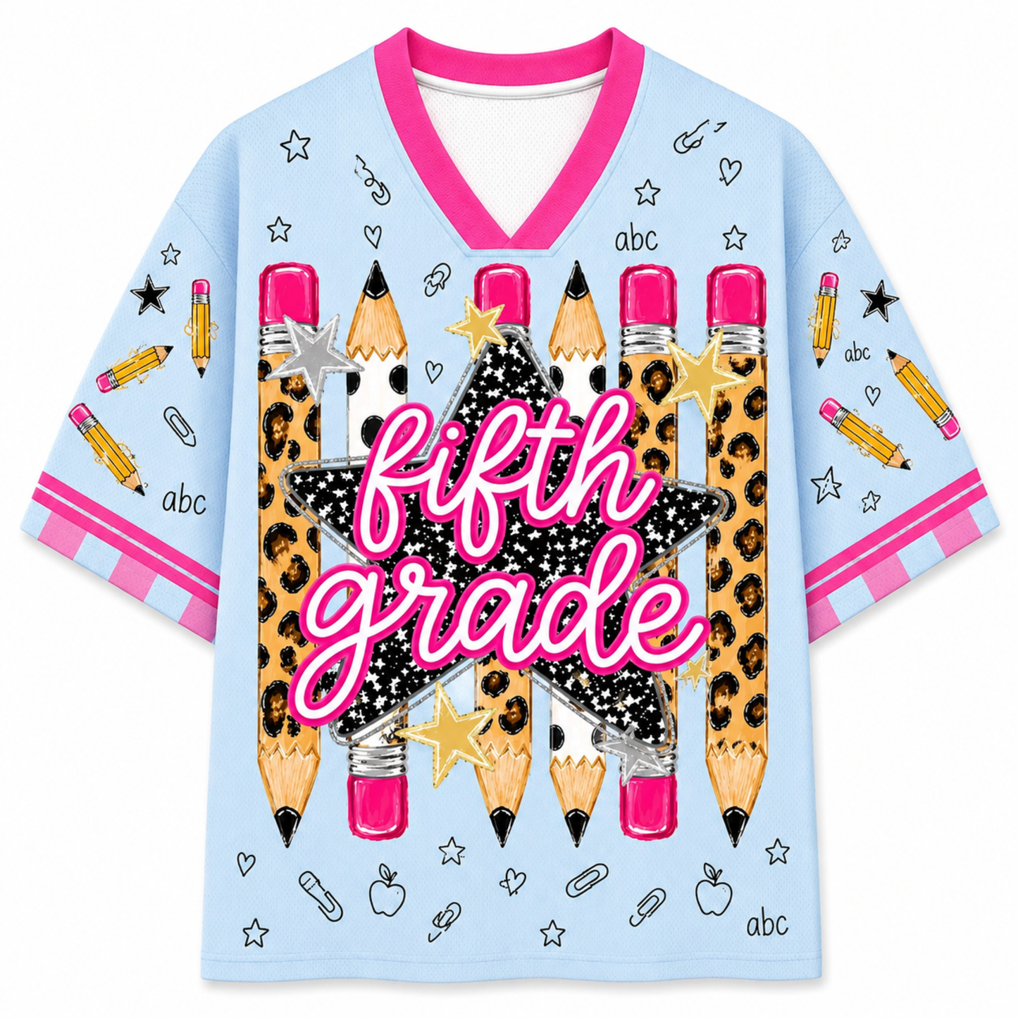 A light blue short-sleeve V-neck t-shirt with a 'fifth grade' school-themed graphic. The design features a large central black star with leopard print and pink glittery text, surrounded by illustrated pencils, stars, paperclips, and small 'abc' labels.