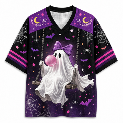 A short-sleeve V-neck t-shirt with a Halloween theme, featuring a white ghost on a swing holding a pink bubblegum bubble, set against a purple and black starry sky background with bats, spiders, and crescent moons.