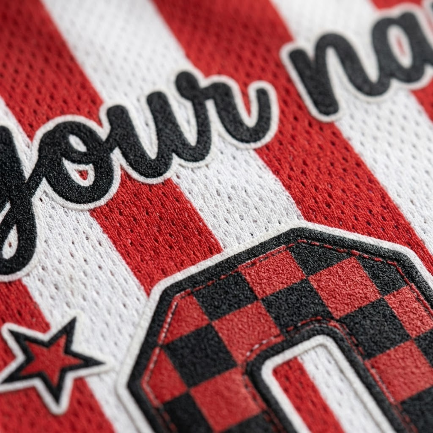 Close-up of a red and white striped athletic jersey with black embroidered script text and a red-and-black checkered number patch.