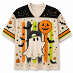 Front view of the cream varsity jersey displaying a cute ghost wearing a snapback hat holding an orange jack-o-lantern balloon over colorful brushstroke stripes.