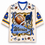 A cream-colored short-sleeve V-neck jersey with blue and yellow athletic graphics, including a large football, star, bow, checkered details, and the word 'Warrior' on the front.