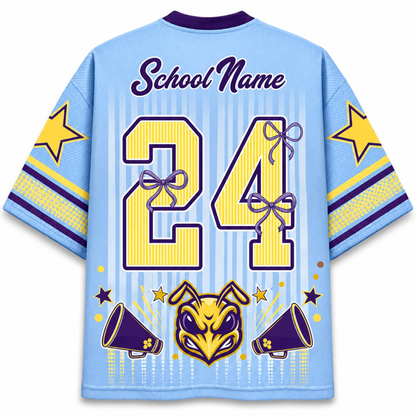 Custom light blue short-sleeve jersey shown from the back, featuring a purple collar, 'School Name' text, the number '24' in yellow with purple bows, a purple and yellow mascot head, and purple and yellow star accents on the sleeves.