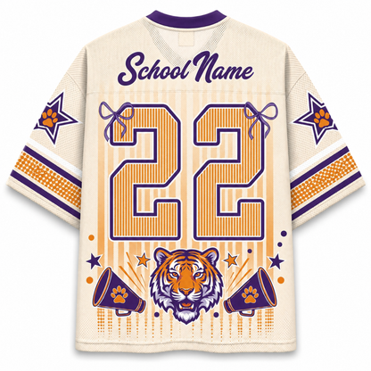 Customizable cream-colored football jersey with purple and orange graphics, featuring a tiger head, megaphones, stars, and the number 22 on the back.