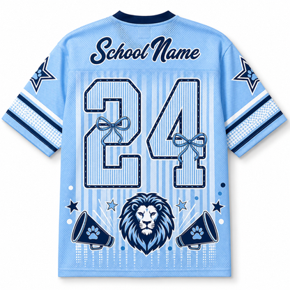 A light blue short-sleeve mesh jersey shown from the back, with navy and white graphics including the text 'School Name', the number '24' with ribbon bows, a lion head, and megaphones. The shirt is photographed on a plain white background.