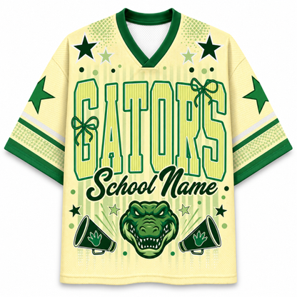 A pale yellow and green custom Varsity Football jersey featuring 'GATORS School Name' text, an alligator head graphic, and star details on the front and sleeves.