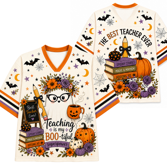 A V-neck graphic T-shirt shown from both front and back on a plain white background. The shirt has an off-white base with orange trim and a Halloween-themed print featuring bats, moons, spiderwebs, pumpkins, books, flowers, glasses, and text including 'THE BEST TEACHER EVER' and 'Teaching is my BOO-tiful superpower.