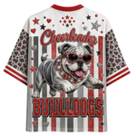 A short-sleeve graphic t-shirt featuring a bulldog wearing red sunglasses and a jeweled collar, with the word 'Cheerleader' above and 'BULLDOGS' below, set against a red, white, and gray striped background with stars and hearts.