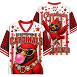 A white and red varsity-style jersey shown from the front and back, featuring a large red cardinal illustration with heart-shaped sunglasses, a pink bubblegum bubble, and 'School Name Cardinals' text. The sleeves and side panels have a red leopard print pattern, and 'Cheerleader Cardinals' appears on the back.