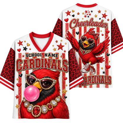 A white and red varsity-style jersey shown from the front and back, featuring a large red cardinal illustration with heart-shaped sunglasses, a pink bubblegum bubble, and 'School Name Cardinals' text. The sleeves and side panels have a red leopard print pattern, and 'Cheerleader Cardinals' appears on the back.