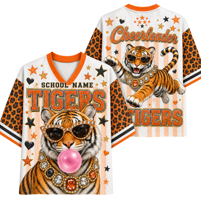 Front and back views of a white V-neck t-shirt with orange and black leopard print sleeves, featuring a cartoon tiger wearing sunglasses and a jeweled collar, with 'TIGERS' and 'Cheerleader' text on a white background.
