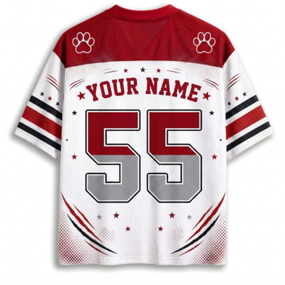 Customizable sports jersey back view with red and white color scheme, featuring paw print graphics on the shoulders, 'YOUR NAME' text, and the number '55' in red and gray.