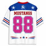 White short-sleeve sports jersey with blue shoulders, red collar trim, red 'MUSTANGS' text, blue and red sleeve stripes, a charging wildcat logo on the chest, and large pink '88' numbers outlined in blue on the back.