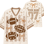 A custom football-themed jersey mockup showing both front and back views. The jersey has a cream mesh base with brown and tan graphics, including footballs, bows, stars, and stripes.