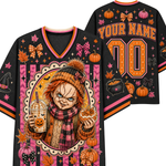 A black mesh V-neck jersey shown from the front and back, decorated with a colorful Halloween theme. The front features a central graphic of a creepy doll character in a knit beanie and scarf holding a drink and a cookie, surrounded by pumpkins, bows, and stars.
