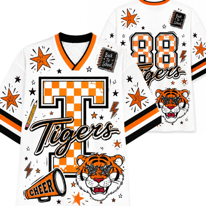 A white V-neck hockey-style jersey with orange and black stripes, featuring a large orange-and-white checkered letter T, the word Tigers in script, a tiger face graphic, stars, lightning bolts, a megaphone, and decorative patches on the front and back.