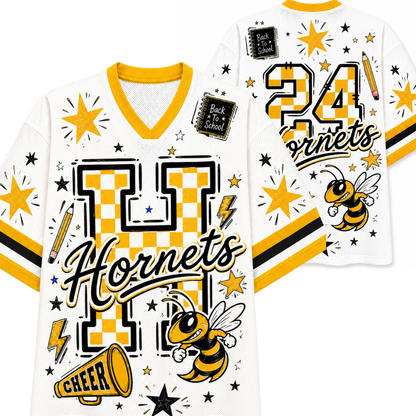 White and yellow varsity-style jersey shown from the front and back, featuring a large checkerboard 'H', the word 'Hornets', the number '24', a hornet bee graphic, stars, lightning bolts, and decorative patches.