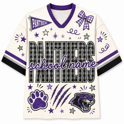 A custom Panthers school spirit jersey in cream with purple and black accents, featuring a V-neck, short sleeves, and various printed graphics including a bow, stars, paw print, claws, and a panther logo.