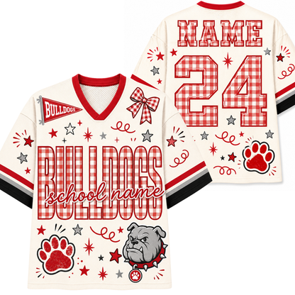 Personalized cream-colored football jersey shown from both front and back, featuring red and white gingham patterned lettering for 'BULLDOGS' and number '24', red paw print, bulldog mascot graphic, and customizable text fields.