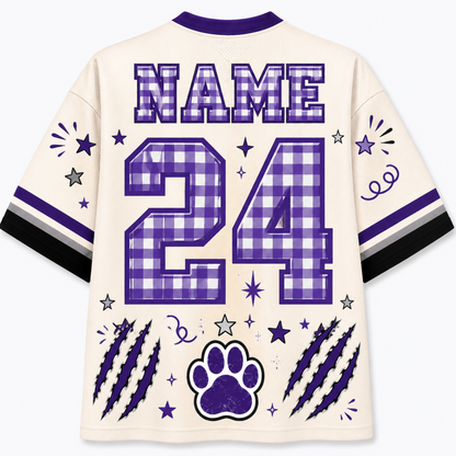 Customizable cream-colored athletic jersey shirt shown from the back, featuring purple and white gingham check patterns on the name and number 24, along with purple paw print, claw marks, and star graphics.