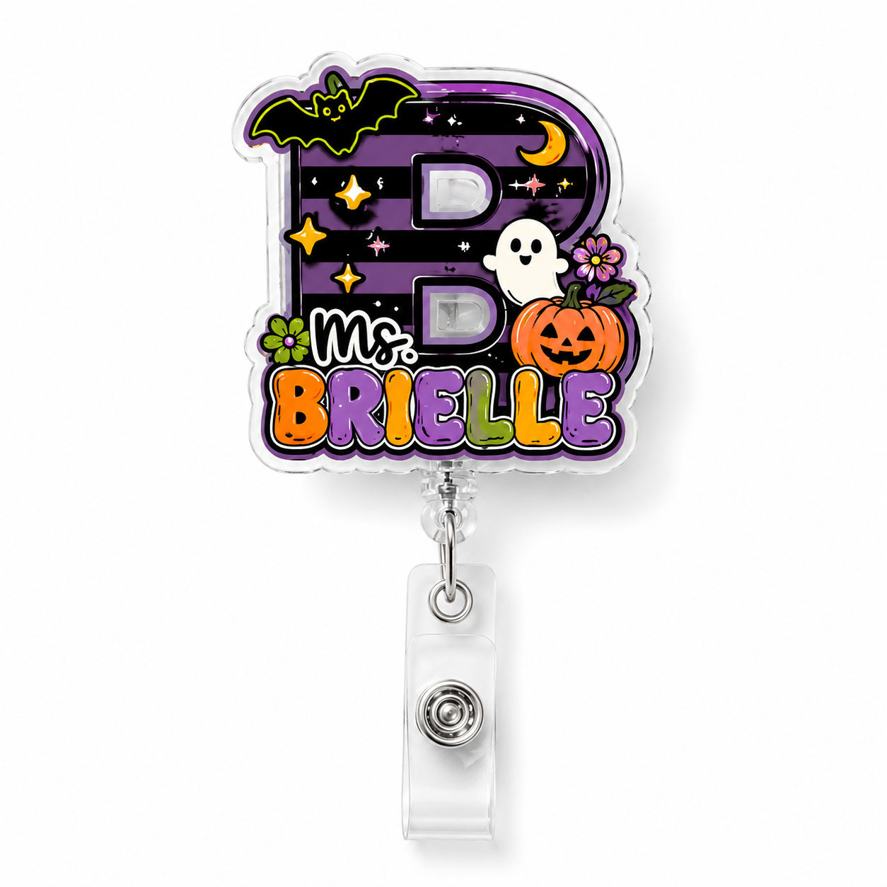 A Halloween-themed retractable badge reel featuring a large letter 'B' decorated with a bat, crescent moon, stars, and a ghost, above the text 'Ms. BRIELLE' in colorful bubble letters.