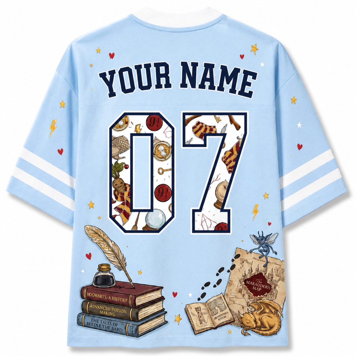 A light blue short-sleeve t-shirt shown from the back, featuring customizable text 'YOUR NAME' and the number '07' filled with wizarding-themed illustrations. The design includes a feather quill, books, a map, a cat, and a butterfly on a clean white background.