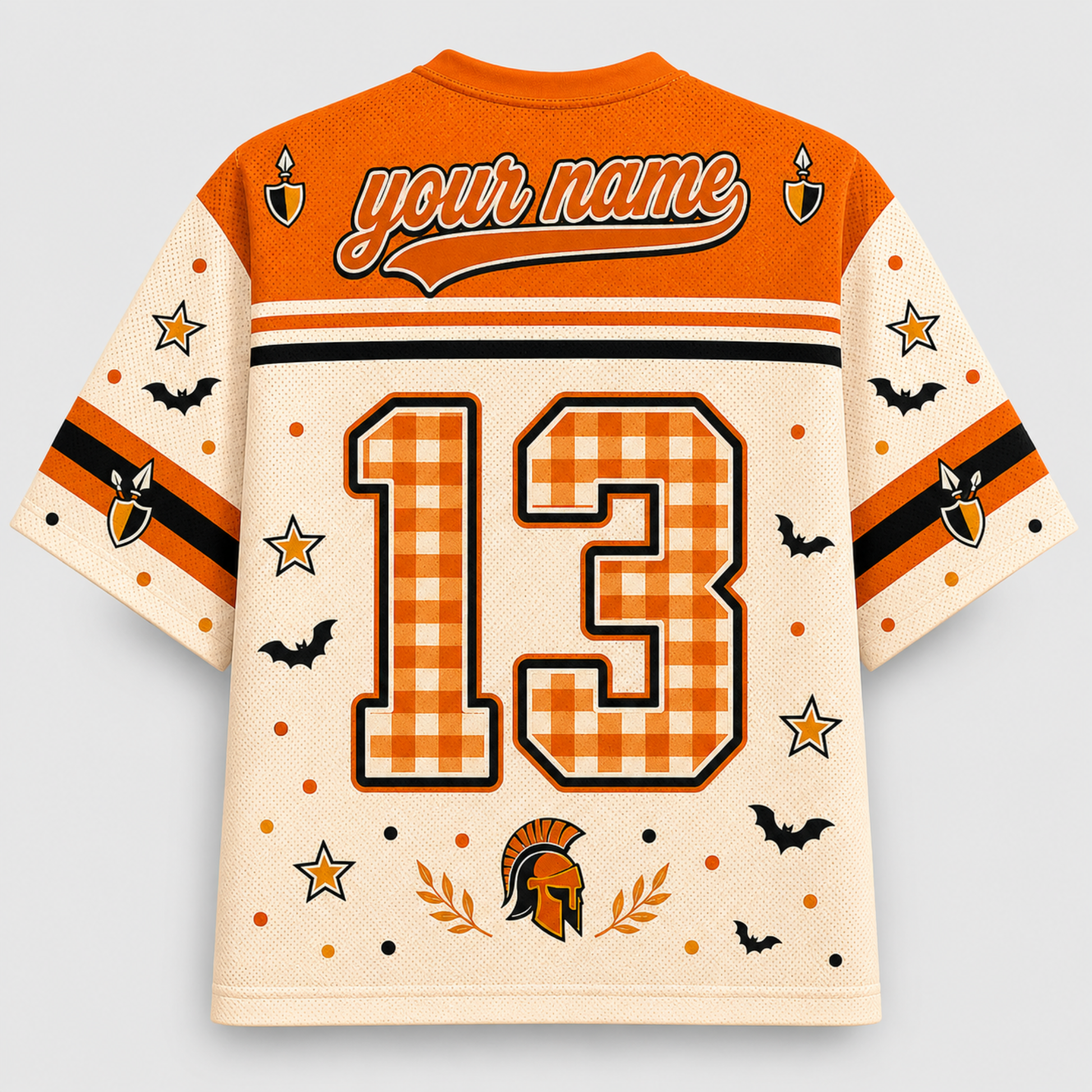 A custom-designed short-sleeve athletic jersey shown from the back, featuring an orange and cream color scheme with a gingham patterned number 13, 'your name' text, and Halloween-themed graphics including bats, stars, owls, and a Spartan helmet.