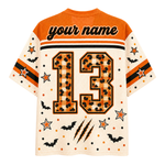 A short-sleeve mesh jersey shown from the back, featuring an orange and cream Halloween theme with 'your name' text, the number 13 in a leopard print pattern, stars, bats, and claw marks.
