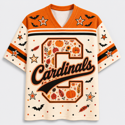Front view of the cream varsity jersey displaying a large plaid monogram letter with script 'Cardinals' text surrounded by black bats and pumpkin doodles.