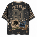 A dark gray short-sleeve t-shirt with a custom sports theme, featuring 'YOUR NAME' and the number '81' on the back. The design includes football motifs, stars, doodles, and two ticket graphics tied with black-and-white striped bows.