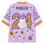 A light purple mesh short-sleeve jersey shown from the back, featuring a personalized Halloween design with the name 'PAISLEY' and number '24' in orange and black, a white ghost, pumpkins, bats, and bows.