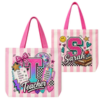 Two pink and white striped canvas tote bags with bright pink handles, shown on a plain white background. The front bag features a colorful graphic with a large letter 'T', the word 'Teacher', stars, hearts, a disco ball, and a bow.