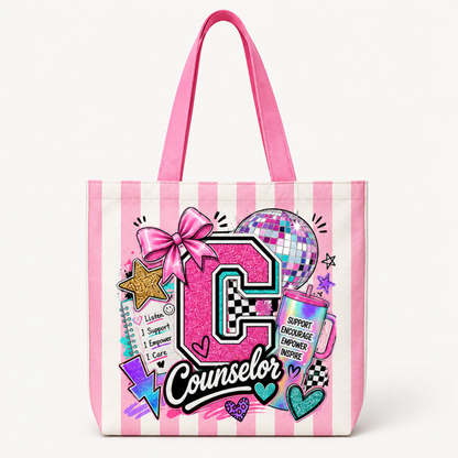 A pink and white striped canvas tote bag featuring a colorful graphic design with the word 'Counselor', a large glittery pink letter 'C', a disco ball, a pink bow, and various motivational text elements, shown on a clean white background.