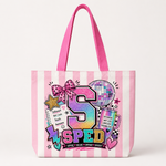 A pink and white striped canvas tote bag with bright pink handles, featuring a colorful retro 'SPED' graphic with a disco ball, stars, and doodles on the front.