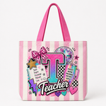 A pink and white striped tote bag featuring a colorful retro 'Teacher' graphic with a large letter 'T', a disco ball, stars, hearts, and motivational text, shown on a clean white background.