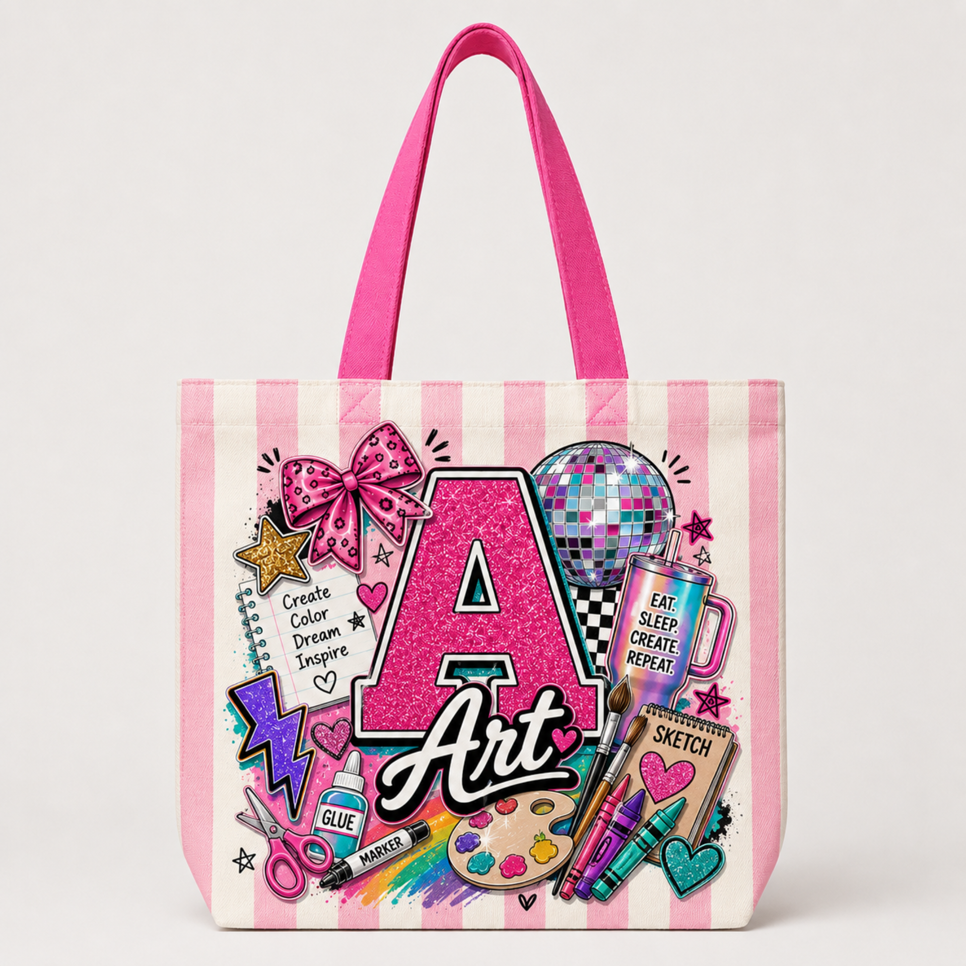 A canvas tote bag with pink and white vertical stripes, featuring a colorful 'Art' themed graphic print with a glittery pink letter 'A', a disco ball, paint palette, and sketchbook illustrations.