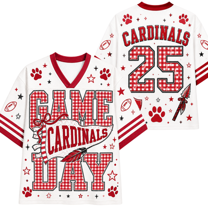 White and red football jersey shown from the front and back, featuring 'GAME CARDINALS DAY' text, 'CARDINALS' and number '25' on the back, paw prints, stars, stripes, and a feather graphic.