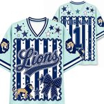 A light blue and navy blue custom sports jersey mockup showing the front and back views. The design features a navy blue and white vertical stripe pattern with scalloped borders, decorated with stars, a large bow, a lion graphic, and customizable text 'Lions' and 'YOURNAME 1'.