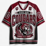A custom V-neck athletic jersey featuring a white body with maroon and black sleeves and collar. The front displays 'COUGARS' in large maroon letters, a graphic of a cougar panther mascot, and the words 'STRENGTH • PRIDE • LEGACY'.