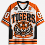 A short-sleeve V-neck athletic jersey with a white mesh base and bold orange and black graphics. The front features the word 'TIGERS' in large black letters with orange outlines, a tiger head illustration below, and the text 'SCHOOL NAME' above.
