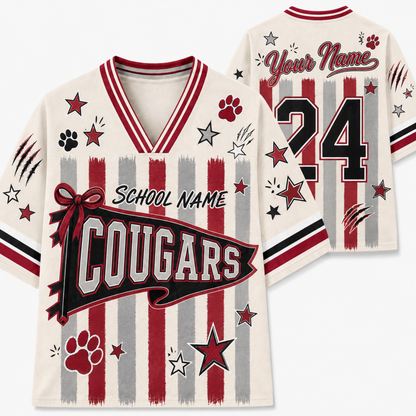 Customizable V-neck sports jersey shown from the front and back on a light gray background. The jersey features a cream base with red and gray vertical stripes, red paw prints, black and red stars, and customizable text reading 'School Name', 'Cougars', 'Your Name', and the number '24'.