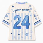 Back view of a customizable short-sleeve jersey in cream with light blue vertical stripes, featuring a large blue number 24, 'your name' text, and blue star and flower graphics.
