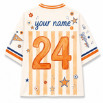 Customizable short-sleeve jersey shown from the back, featuring orange and beige vertical stripes, a large orange number 24, blue script text reading 'your name', and orange, blue, and white decorative star and flower motifs on a white background.