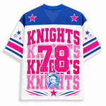 A short-sleeve athletic-style T-shirt shown from the back, featuring a white body with royal blue shoulders and collar, large distressed pink text reading 'KNIGHTS 78 KINGS', pink and blue star graphics on the sleeves, and a blue knight helmet logo near the lower back.