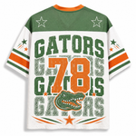 A Florida Gators themed short-sleeve t-shirt with a distressed graphic design. The back of the shirt features a green yoke with white stars, a white body, and orange and green stripes on the sleeves.