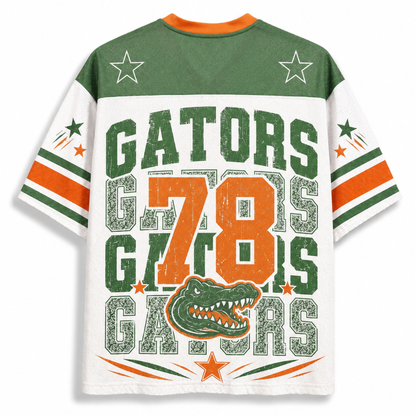 A Florida Gators themed short-sleeve t-shirt with a distressed graphic design. The back of the shirt features a green yoke with white stars, a white body, and orange and green stripes on the sleeves.