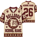 Customizable bulldog-themed football jersey shown from both front and back views. The jersey features a cream mesh base with maroon and gold graphics, including a bulldog mascot logo, paw prints, and placeholders for 'BULLDOGS' and 'SCHOOL NAME' along with the number '26'.