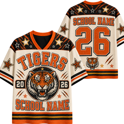 A custom tiger-themed sports jersey shown from both front and back. The jersey has a cream base with orange and black graphics, featuring a roaring tiger graphic, the word 'TIGERS', a large number '26', and placeholder text for school name and number.